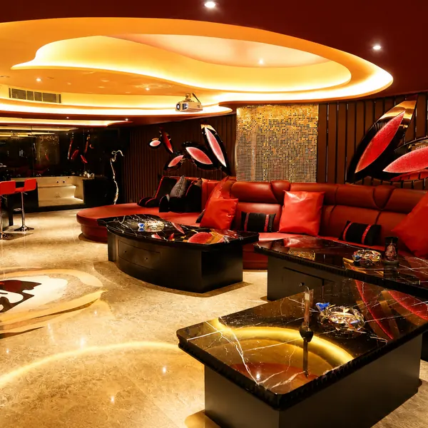 Red sofa lounge with purple stage lighting