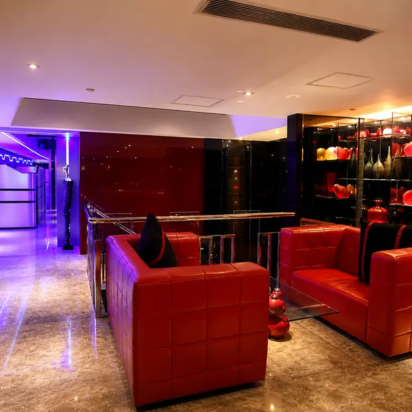 Wood locker room with red bench seating