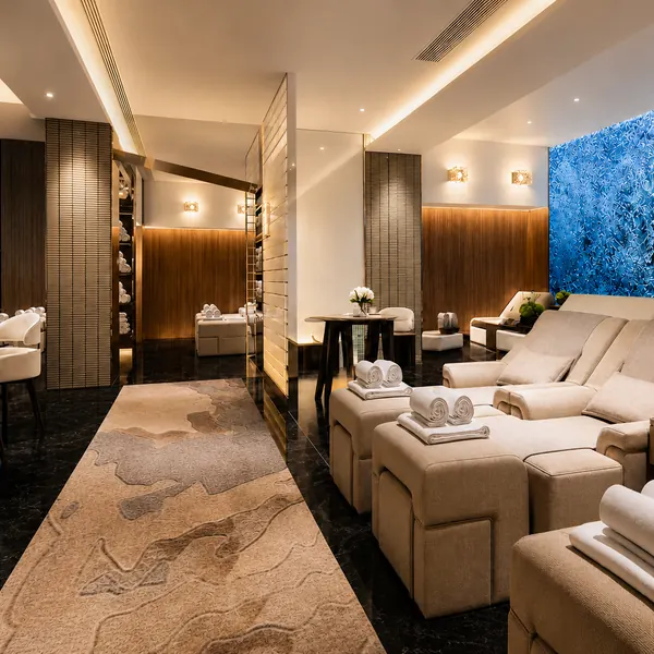 White recliner lounge with a blue feature wall