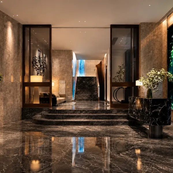 Marble entrance stairs with a water feature wall