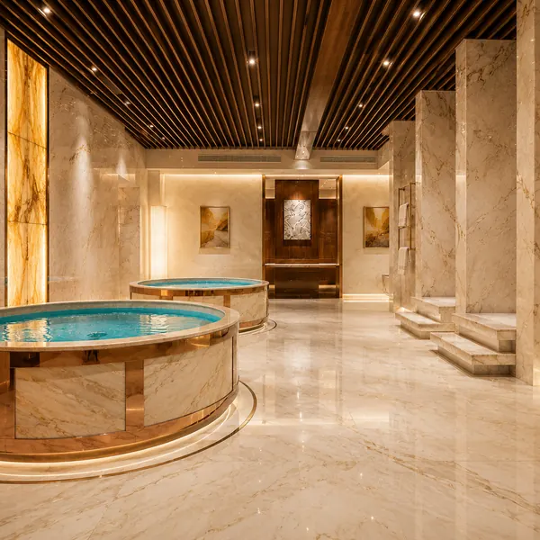 Light marble bathing area with bench seating