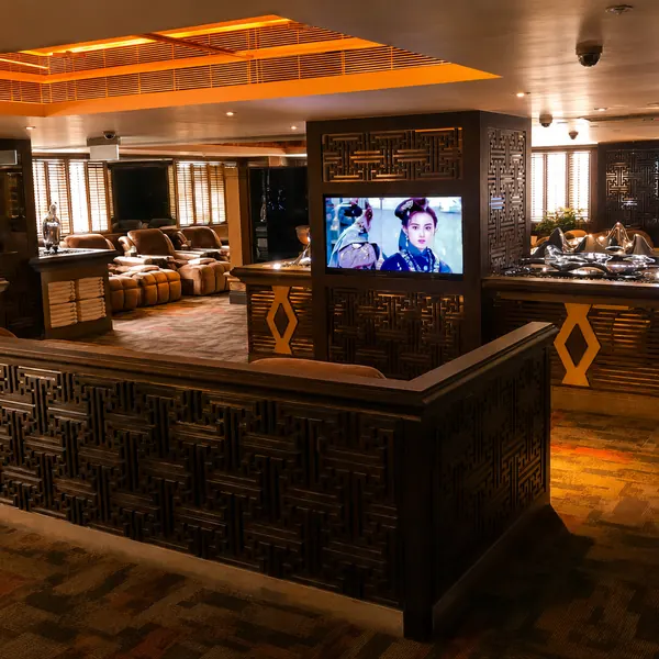 Wood-toned dining and TV lounge