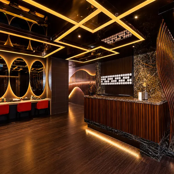 Black-and-gold reception with round window details