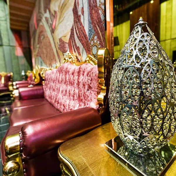 Pink sofa with decorative cage details