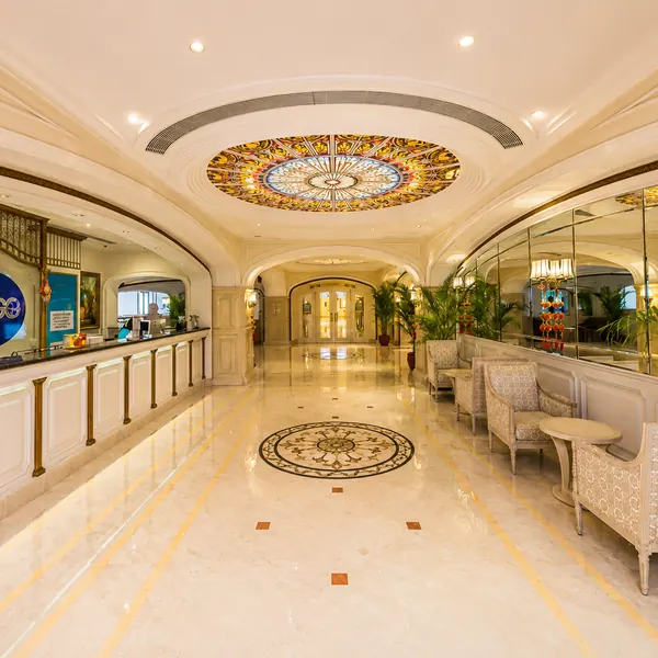 Bright hotel corridor with lounge seating