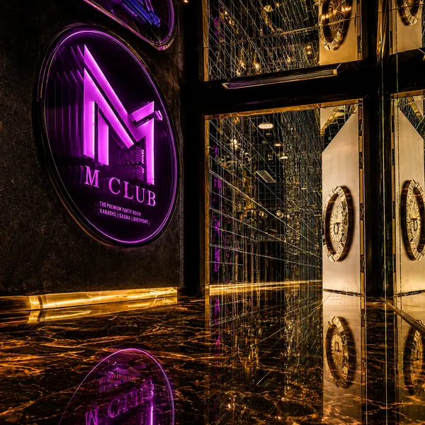 Purple M Club neon entrance