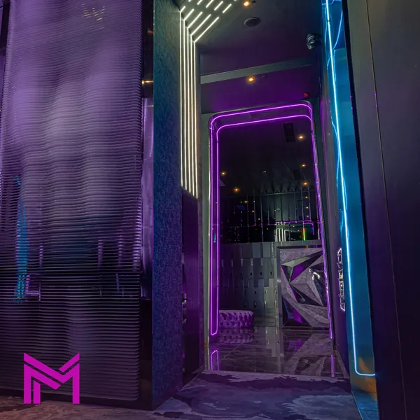 Purple corridor with M Club signage