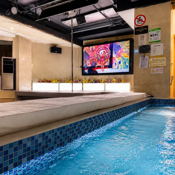 Poolside stage with a TV wall
