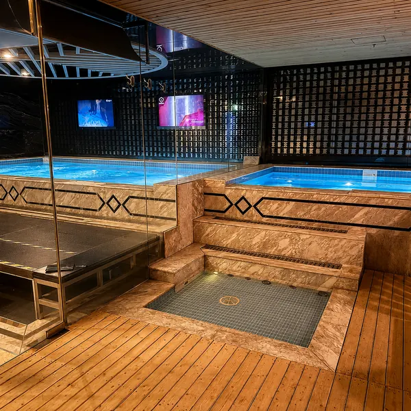 Large soaking pool with a wood-deck platform