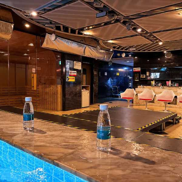 Wet area with waterbed platform and lounge chairs
